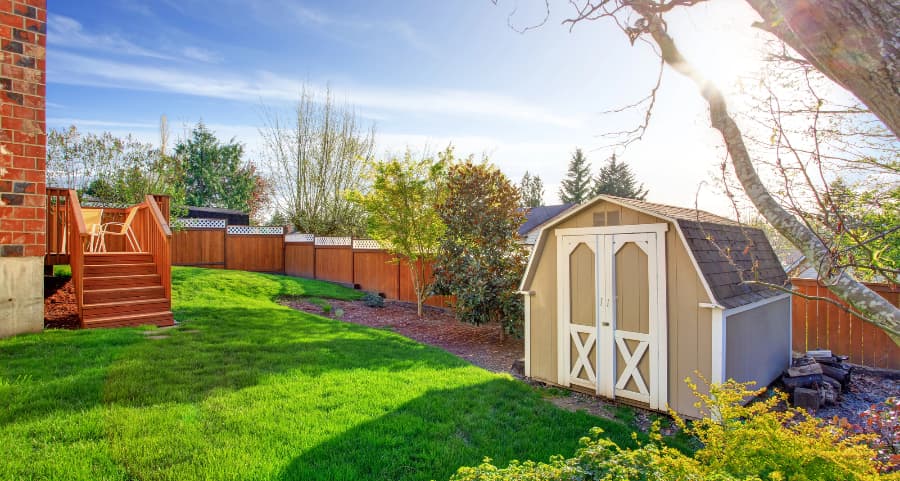 Fenced backyard with storage shed in Texarkana